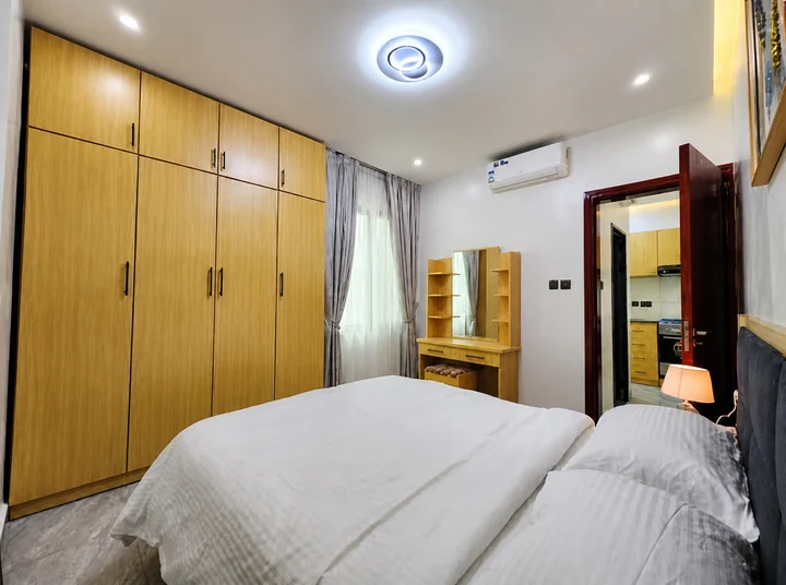 Comfortable furnished bedroom with built-in storage