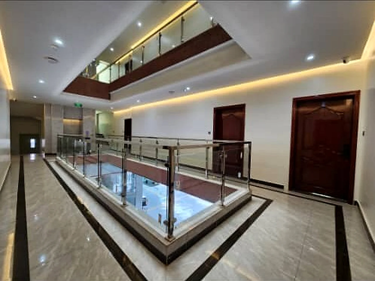Well-lit internal corridor at Elevate Heights Apartment
