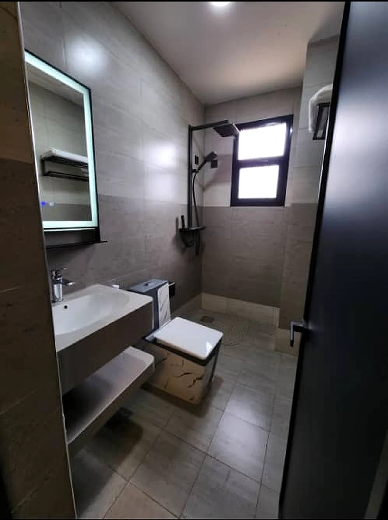 Modern enclosed bathroom at Elevate Heights Apartment