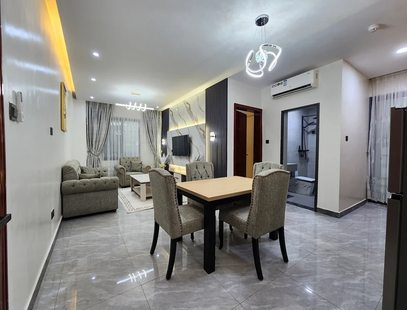 Bright furnished living and dining space at Elevate Heights Apartment