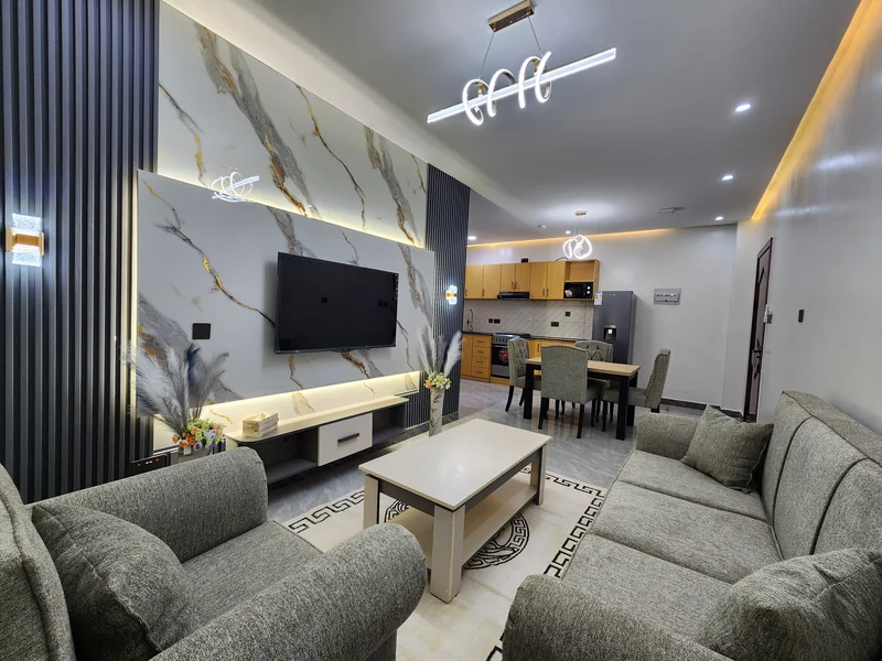 Furnished Elevate Heights Apartment living room with a carpeted seating area